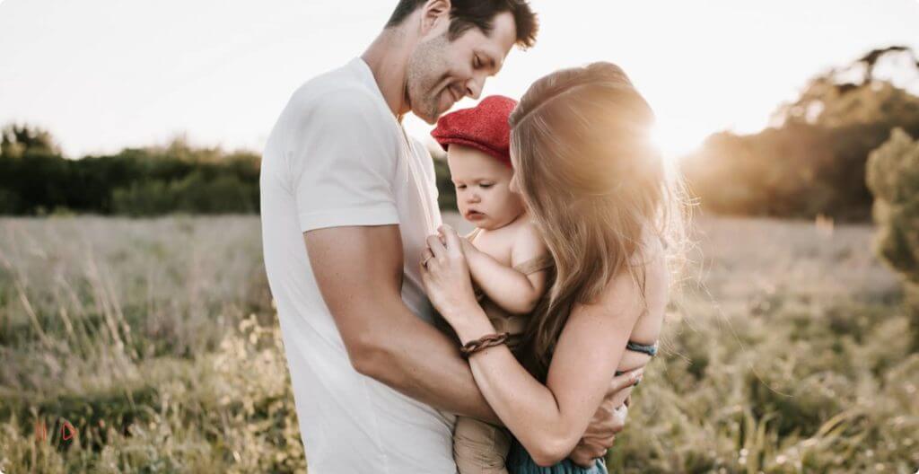 Couple holding child in their arms